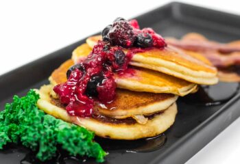 #012  Chocolate Chip Protein Pancakes with Syrup, Macerated Berries and Applewood Smoked Bacon